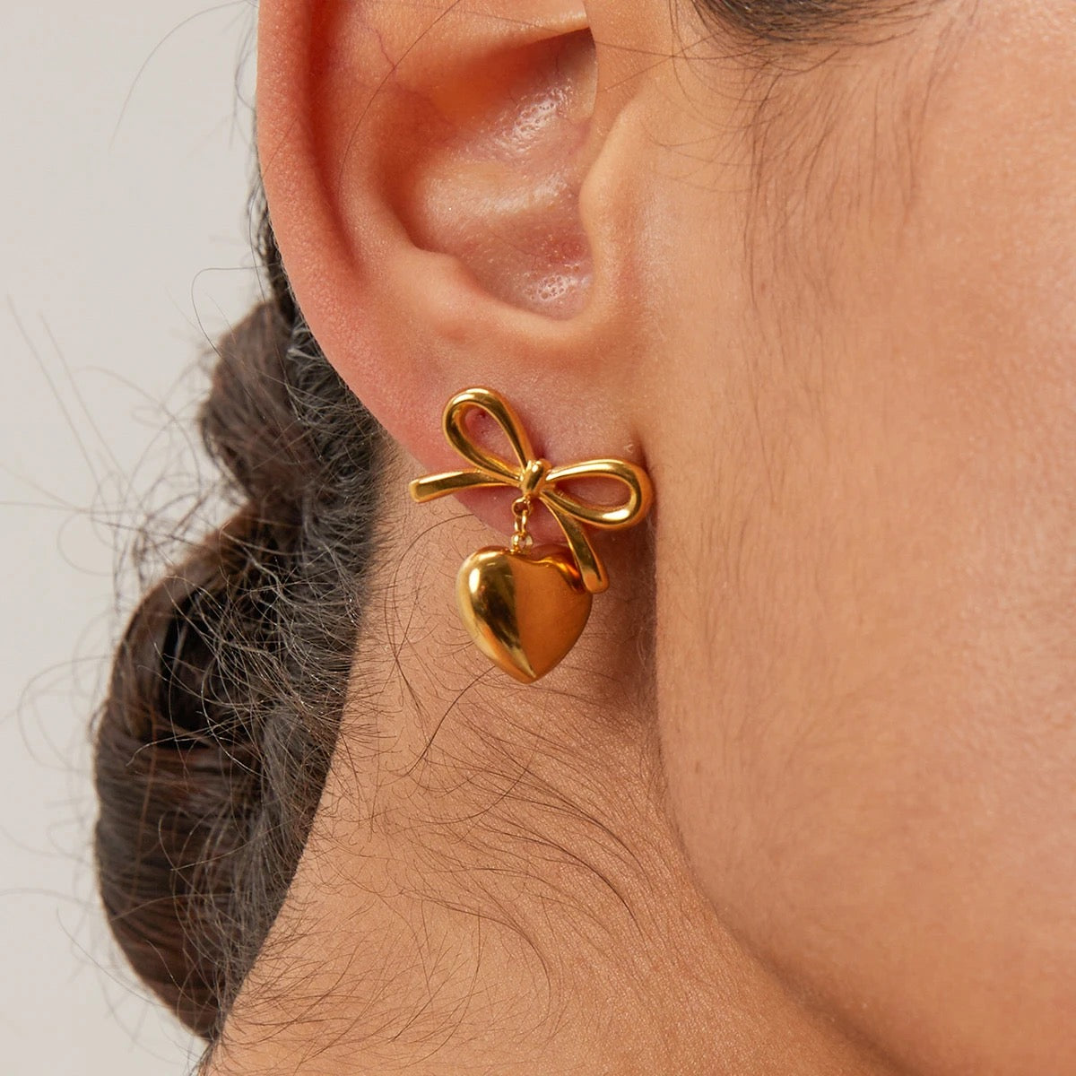 Gold heart bow earrings