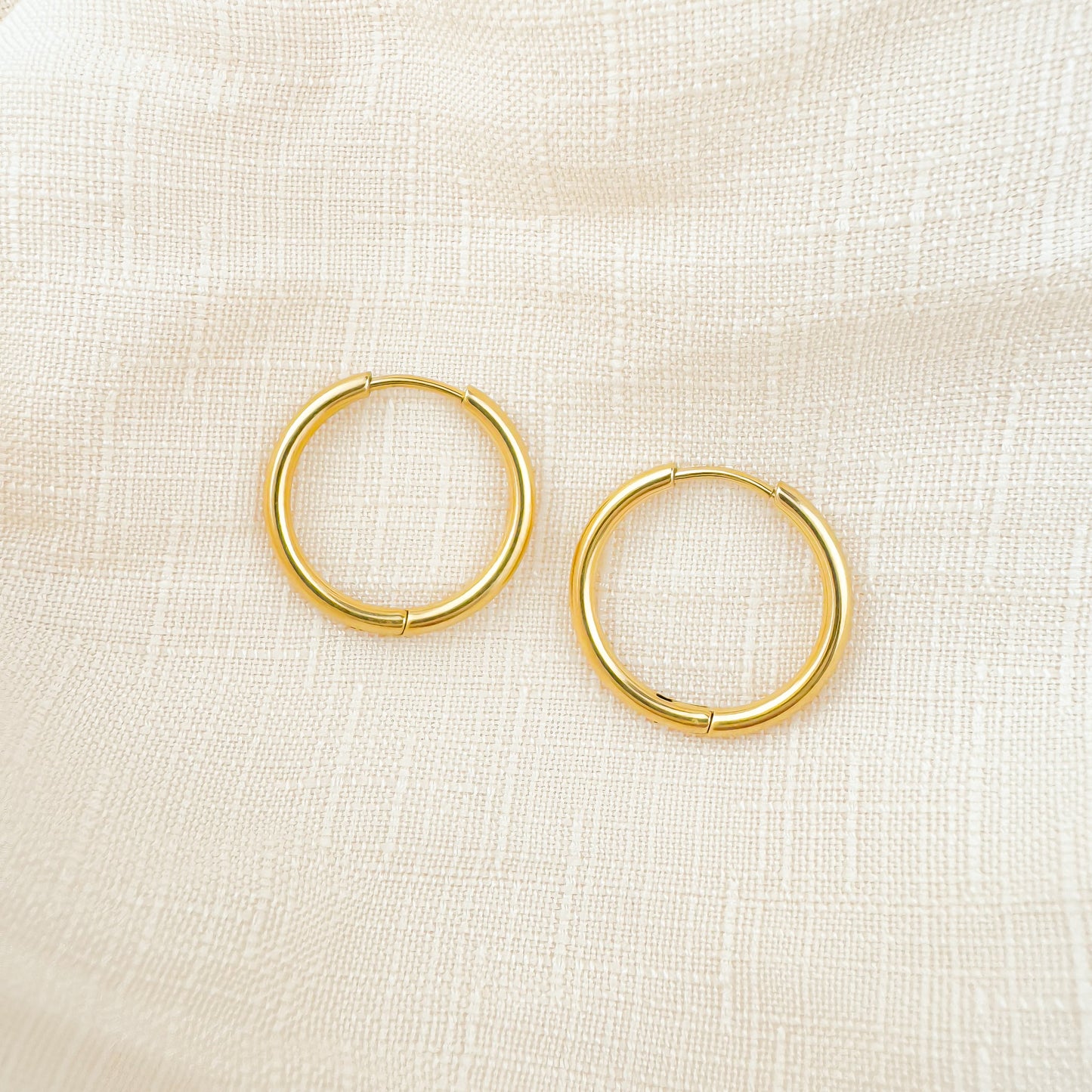 Bailey 10mm gold huggies earrings