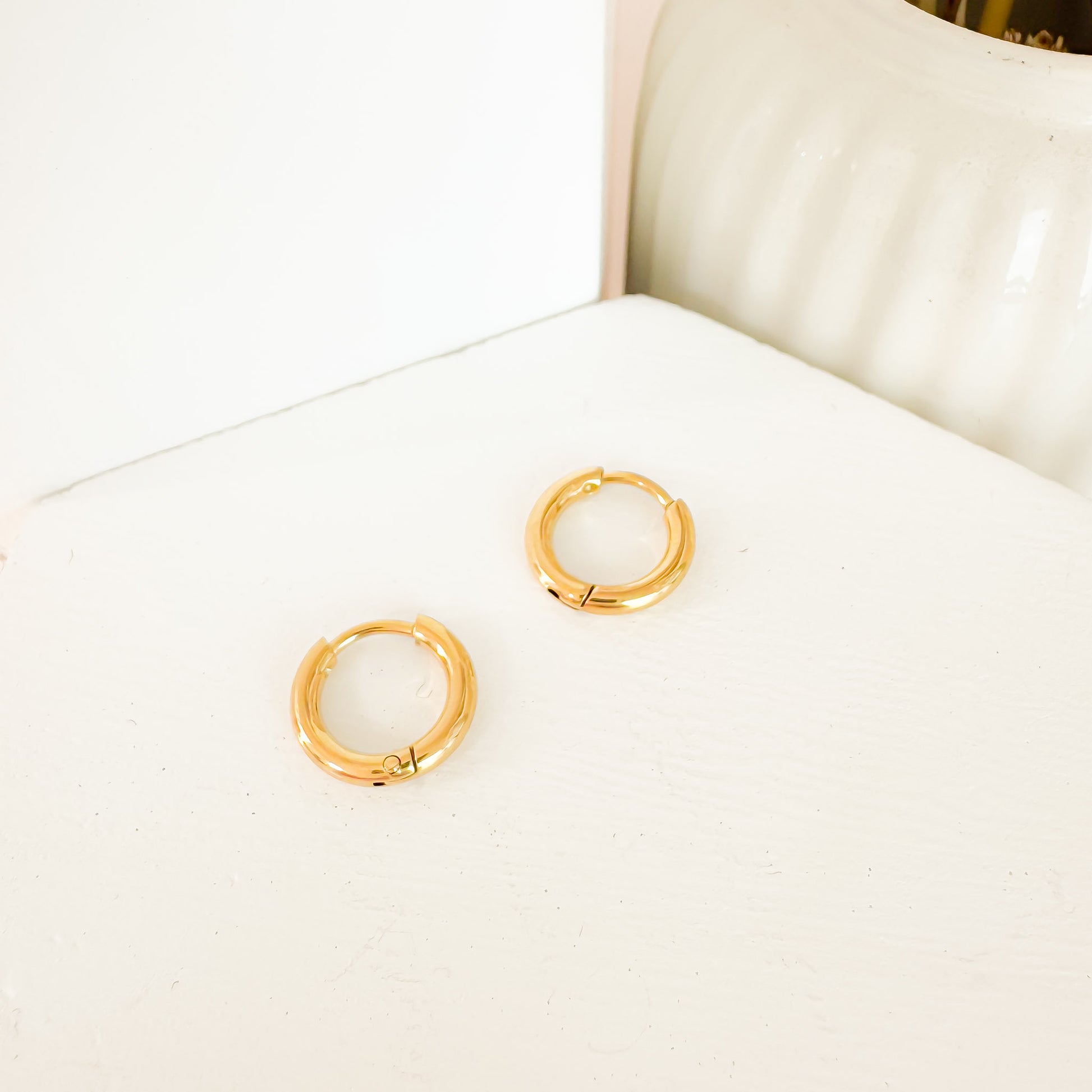 Bailey 8mm gold huggies earrings