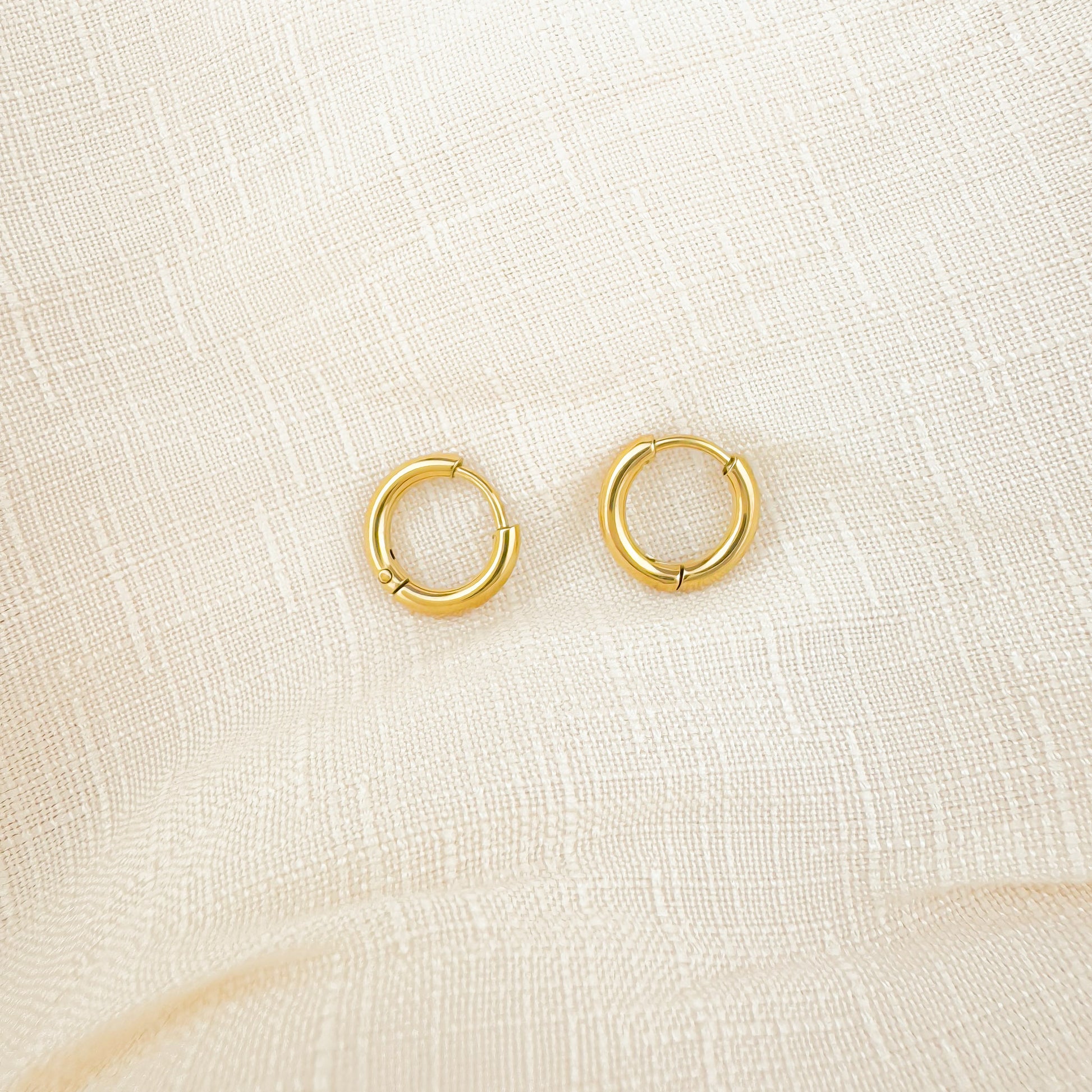 Bailey 8mm gold huggies earrings