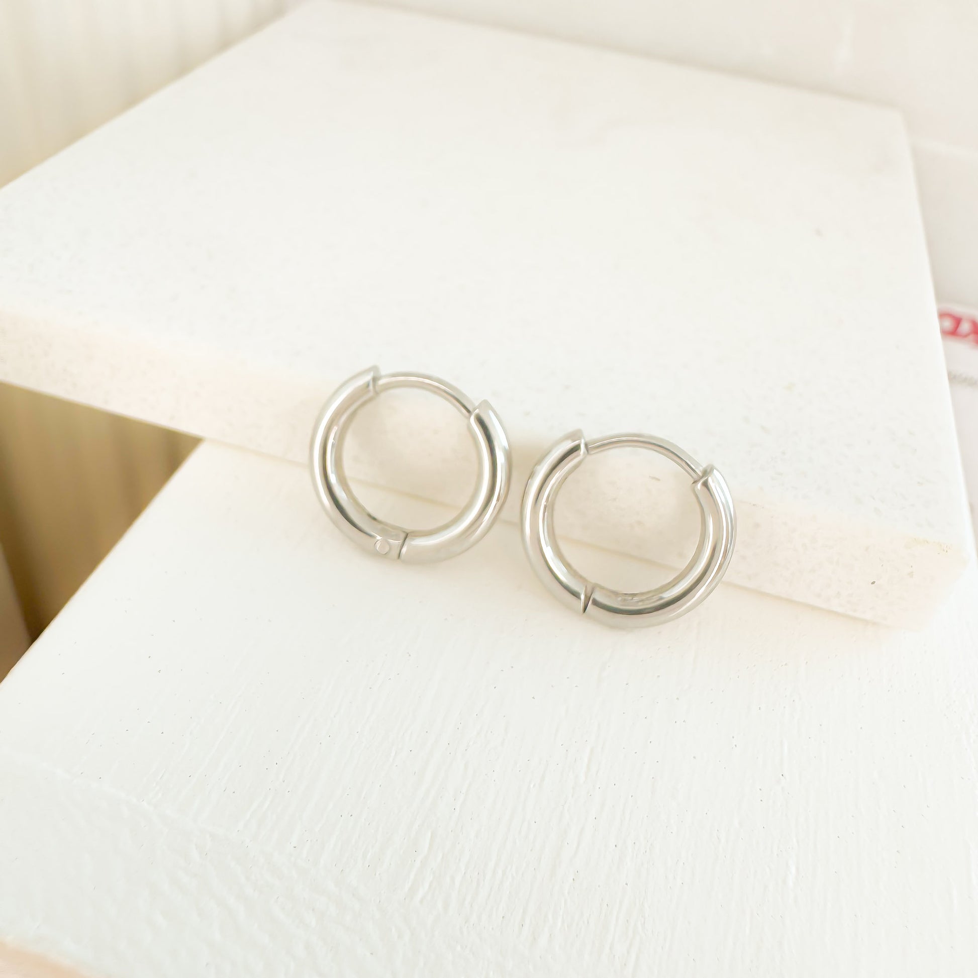 Bailey 8mm silver huggies earrings