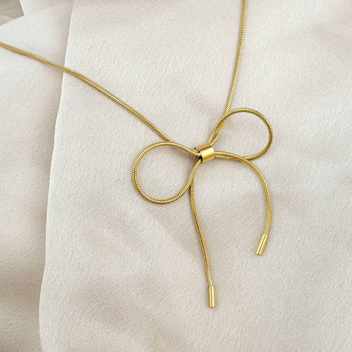 gold harmony bow tie necklace