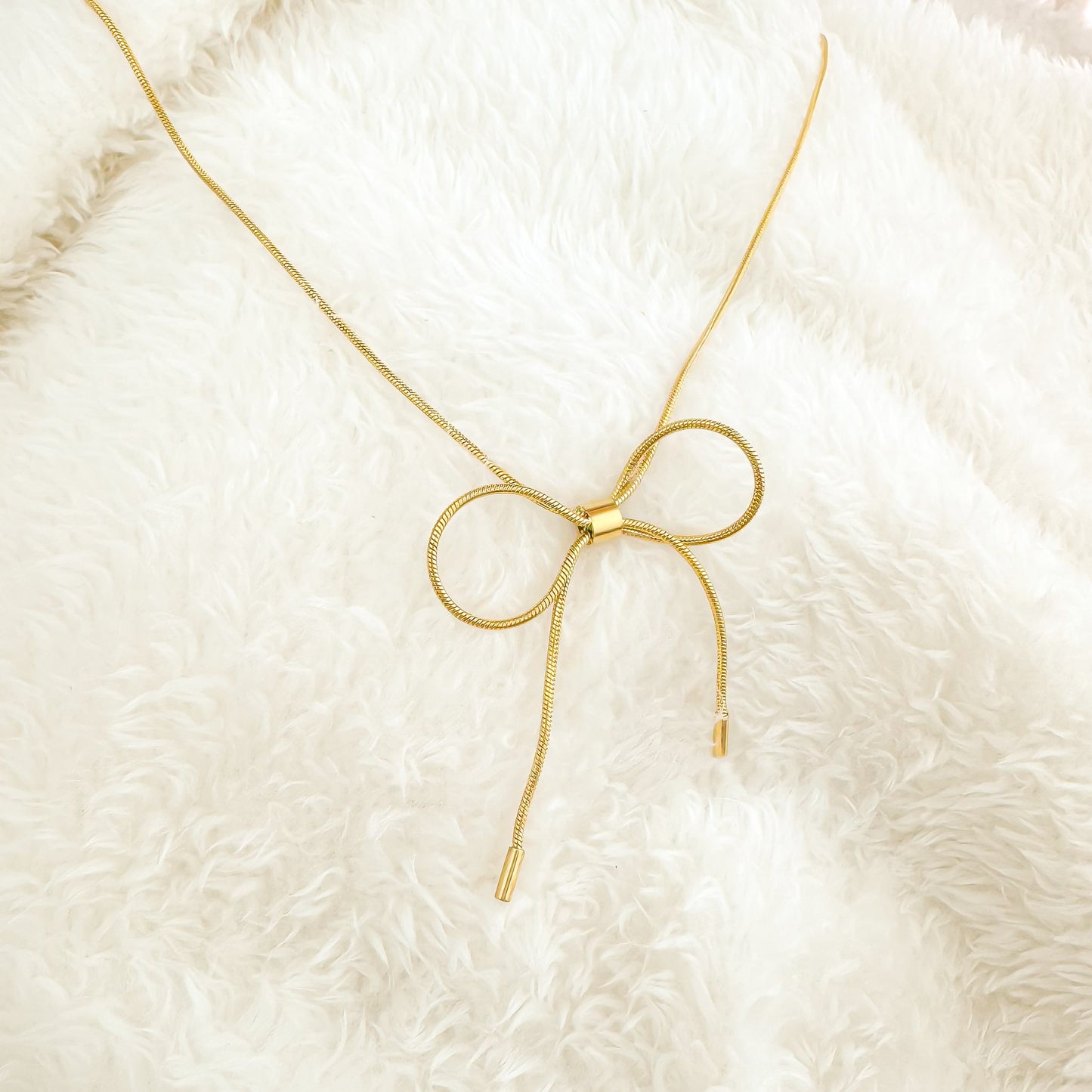 gold harmony bow tie necklace